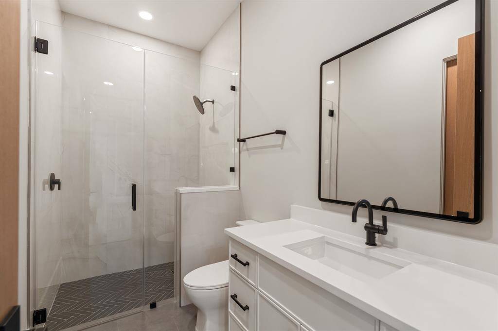 This semi-private bathroom is accessible from the sixth bedroom/media room or the game room.