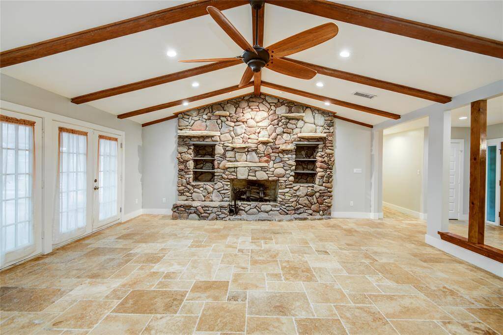 Majestic fireplace is the centerpiece of this home
