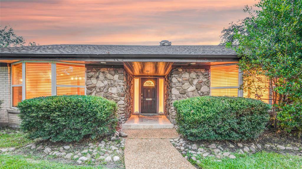 Impressive stone entryway under the new roof