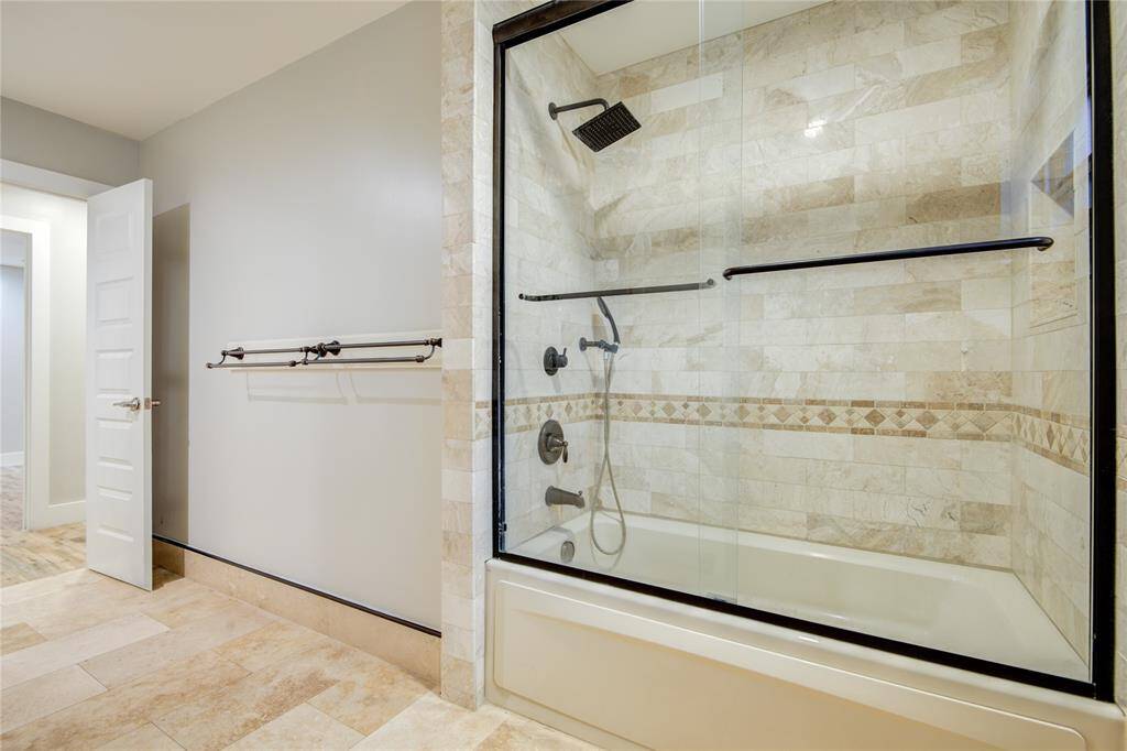 2nd bath has a jetted soaking tub & glass doors.