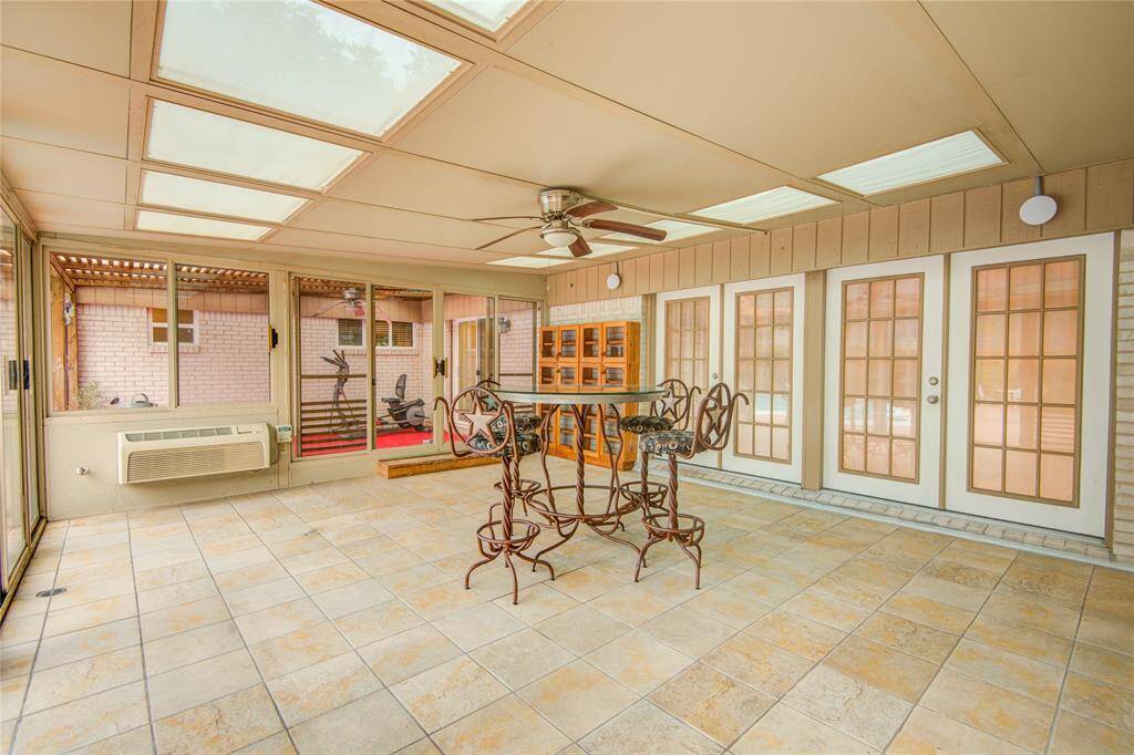 Glassed in sunroom leads into living space w/ air & skylights!