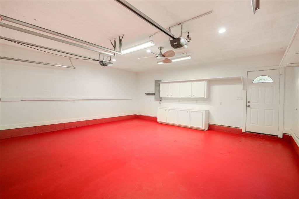 Cabinetry in garage, new breakers & door to pool area