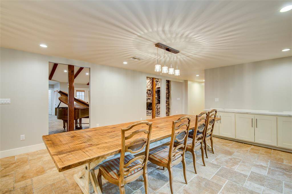 Dinning room accommodates an 18 ft table w/ built in buffet & bay window