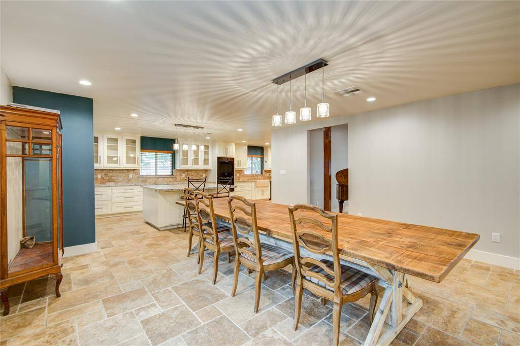 Dining leads into kitchen extension w custom cabinetry & Island