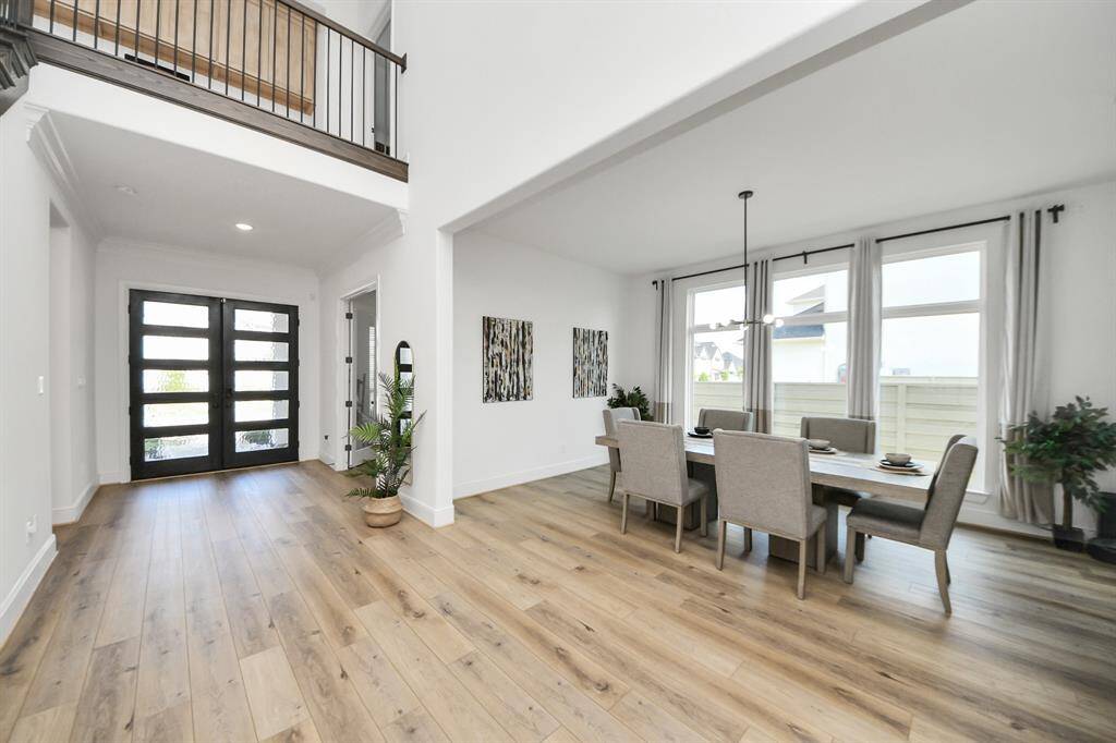 Soaring 20 ft ceilings create a grand and inviting atmosphere for family and guests