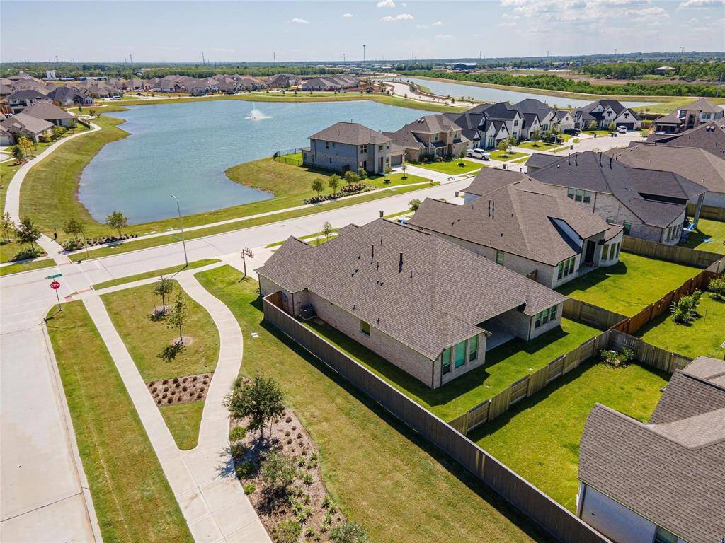 Stunning home on corner lot with lake views in Coastal Point.
