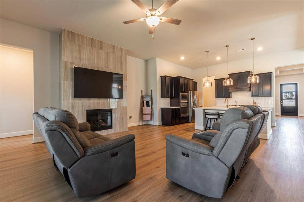 Another view of the large living room and open concept design to the kitchen.