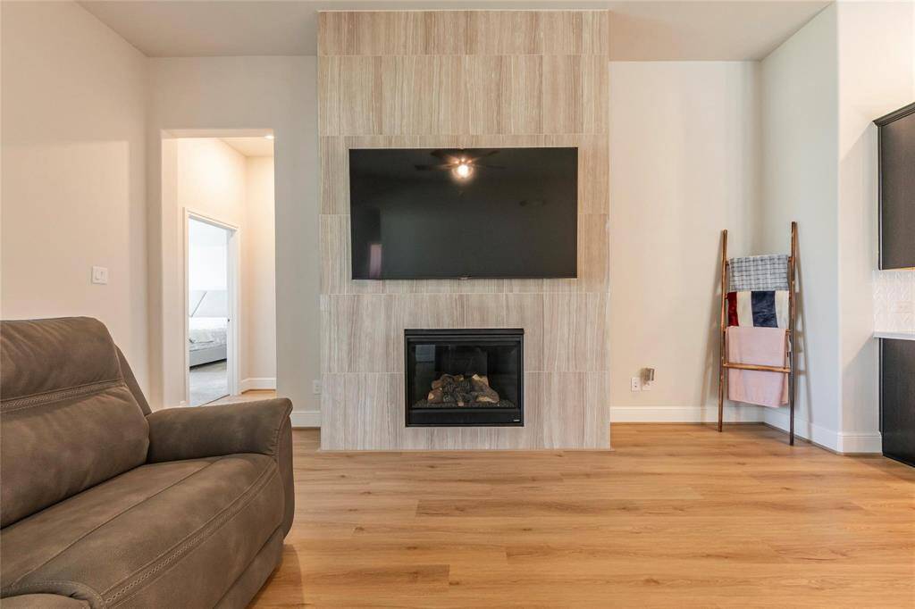 Beautiful gas fireplace with TV mount overhead.