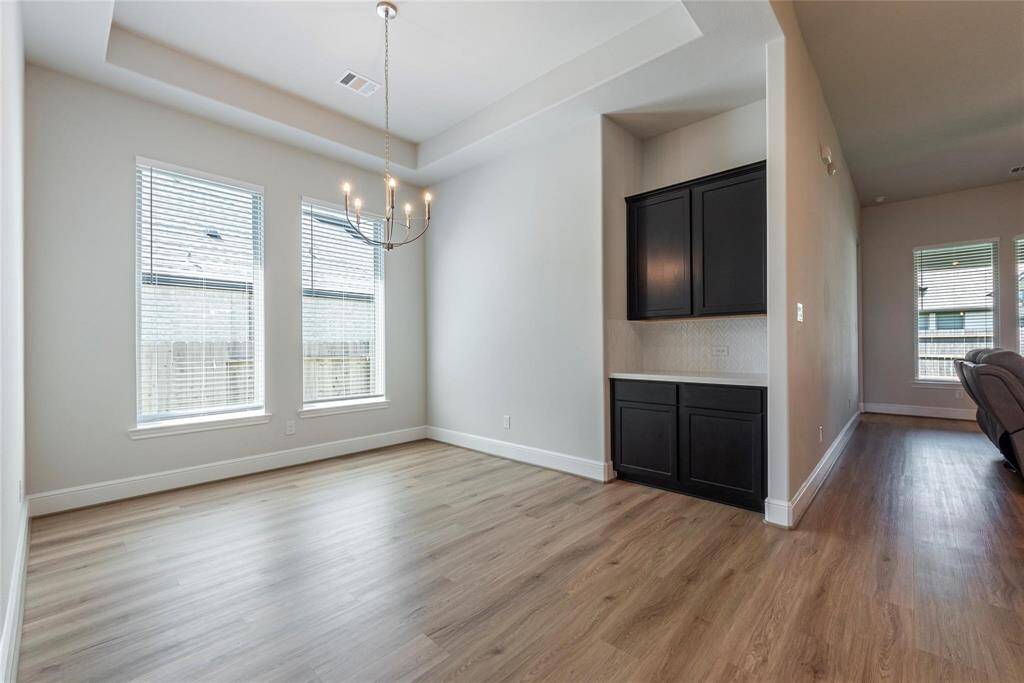 Elegant formal dining room with built-in Omega stone counter tops and cabinet storage.