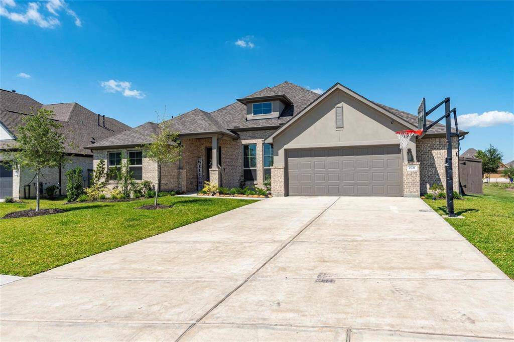 3-car oversized tandem garage with 5-foot extension and double wide driveway.