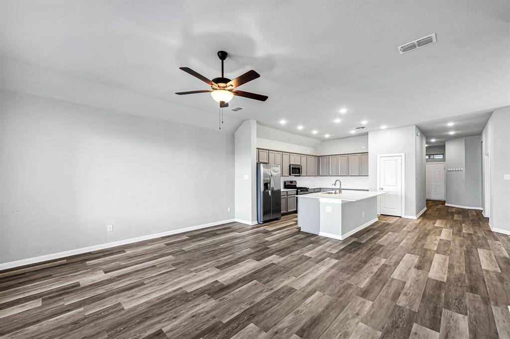 No carpet in this home! The luxury vinyl plank flooring flows throughout all of the bedrooms and main living areas for a seamless look. Tile is featured in the bathrooms and laundry room.
