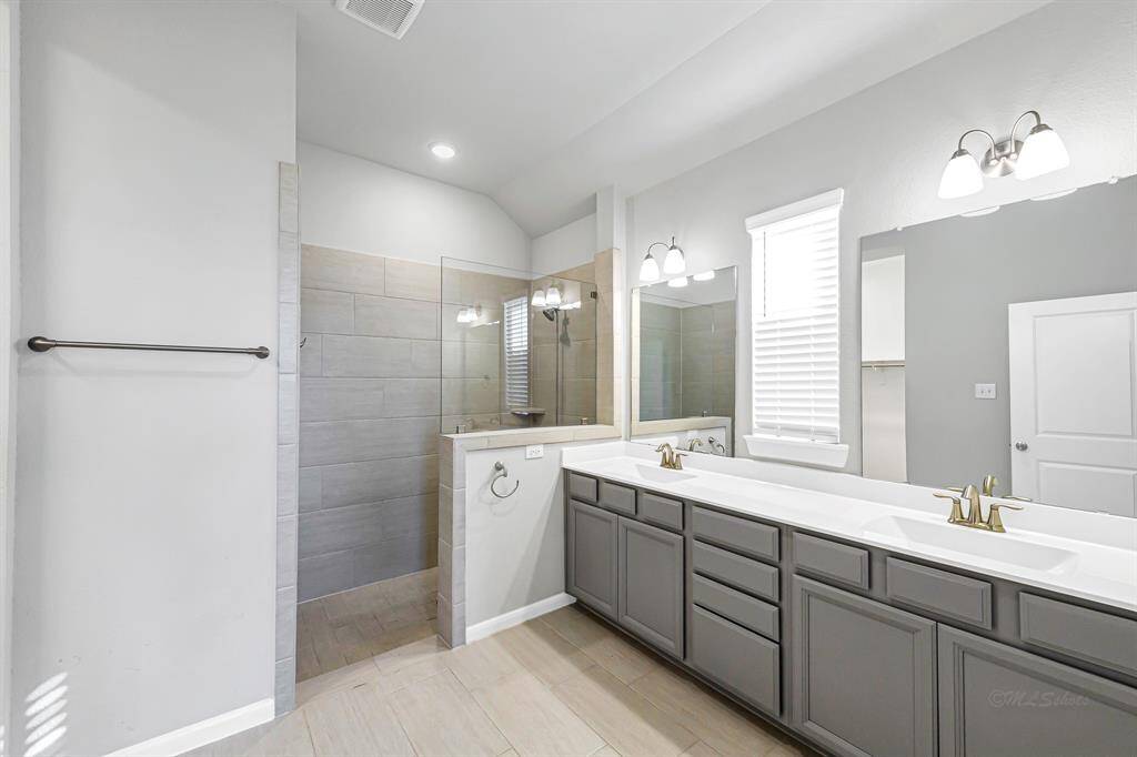 The primary bathroom is sure to please with an oversized shower.
