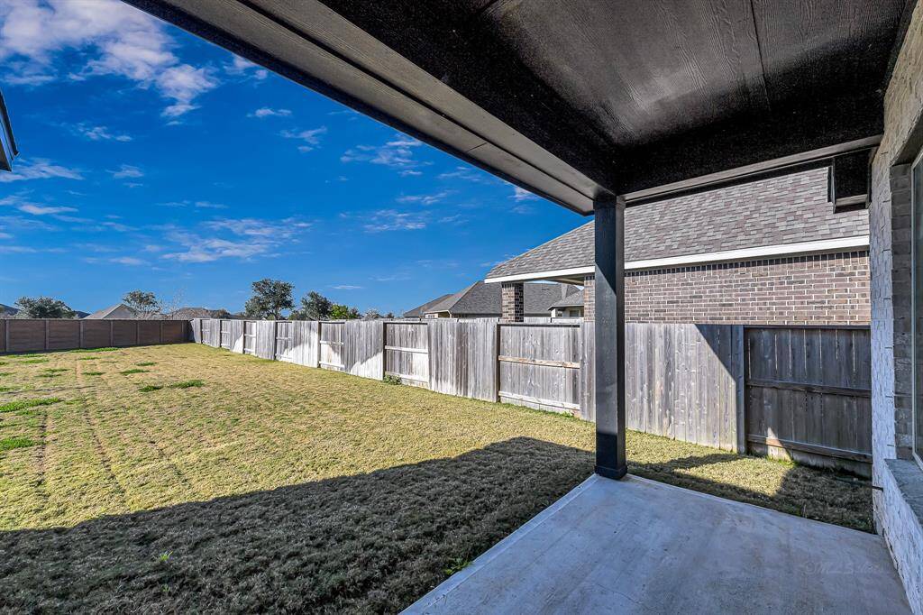 Stepping into the backyard, you'll enjoy the covered back patio space and no back neighbors.