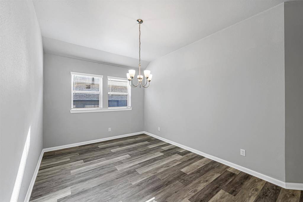 The dining space is right off of the kitchen with room for a big table.