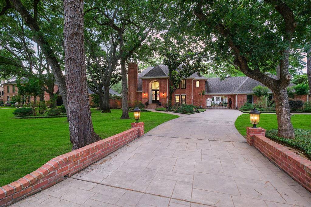 Welcome Home to your retreat in coveted Memorial Drive Acres on an oversized lot! The Private Gated Drive-way leads to a Porte-Cochere and a 3-Car epoxy-floored garage.