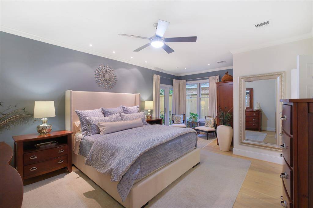 The Primary Bedroom displays a tasteful (and soothing!) designer paint scheme, crown molding, recessed lighting, Sitting Area, and exclusive access to your private Owner's Patio.