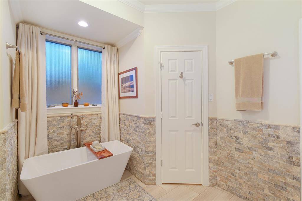 Relax in the soaking tub in the primary bathroom. There is an updated separate shower in the primary bathroom as well.