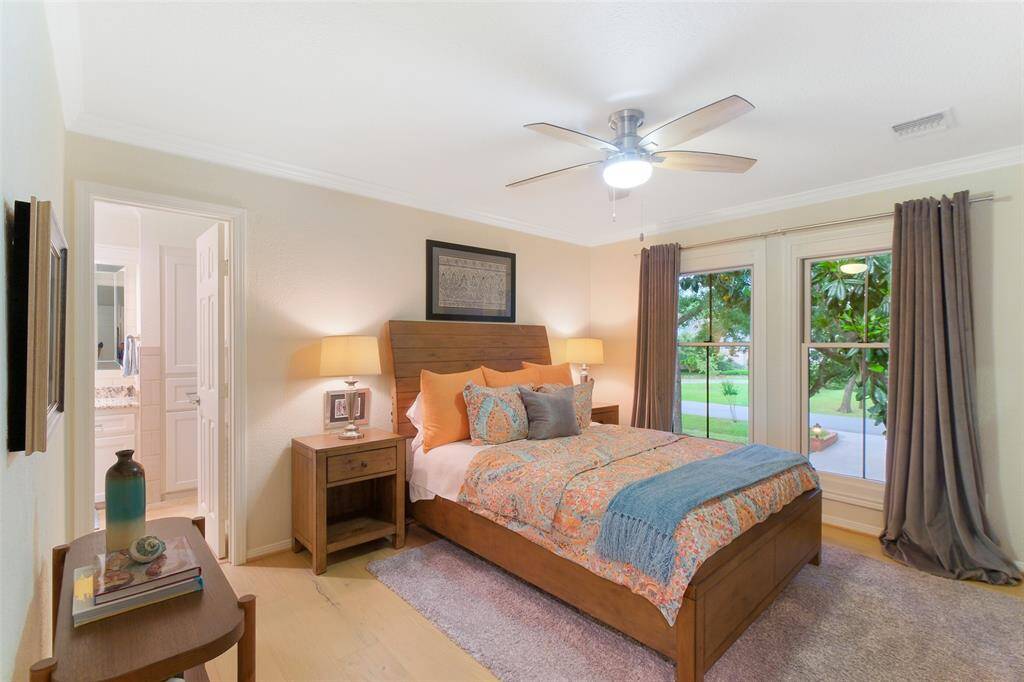 The Floor to Ceiling Windows in this guest bedroom with a large walk in closet and access to the Jack and Jill Bathroom makes this Bedroom picture perfect! This Bedroom elicits a serious "Wow!" factor.