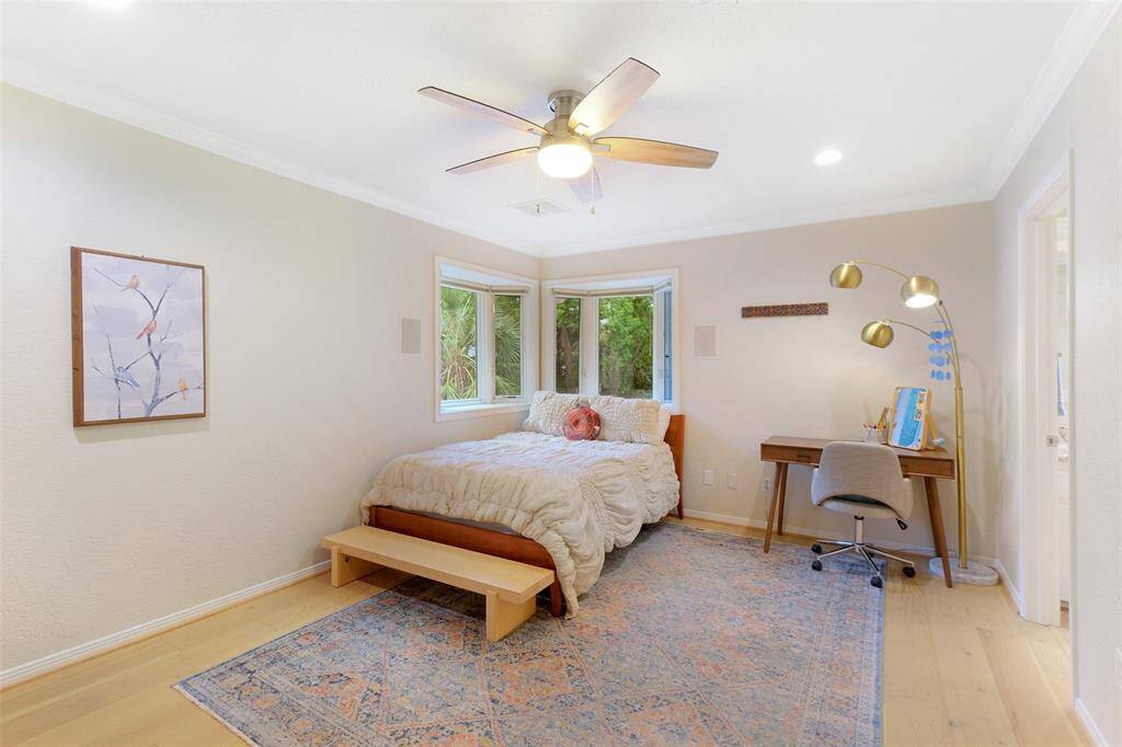 Oversized Guest Bedroom with Corner Windows with backyard views, walk in closet and access to the Jack and Jill bathroom. The Elevated Views of the wonderful back yard, alone, make this Bedroom memorable! This Bedroom joins the others by being freshly painted and so well decorated. This room also has access to attic storage space.