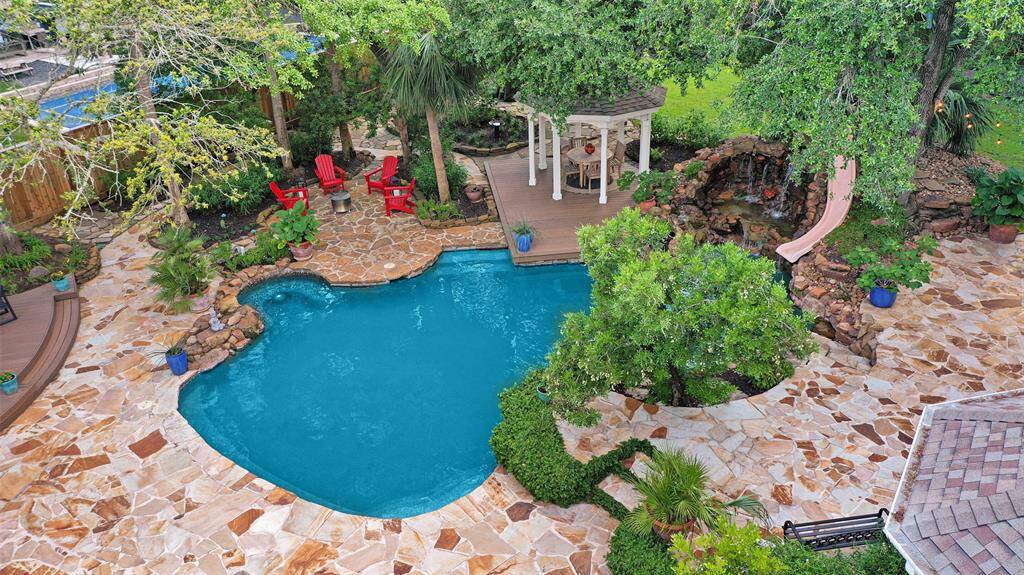 An interesting and lovely elevated view of the pool. In the evenings enjoy the recently installed low voltage landscaping lighting.