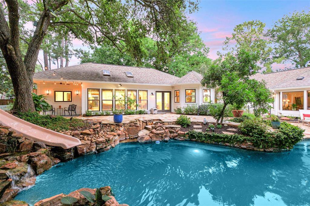 The consummate Entertainer Host's Dream....an 1198 SF Guest House sits privately-positioned behind the main house and by the pool and features a full kitchen, bathroom, spa, sauna, murphy bed, and attached golf cart garage and storage.