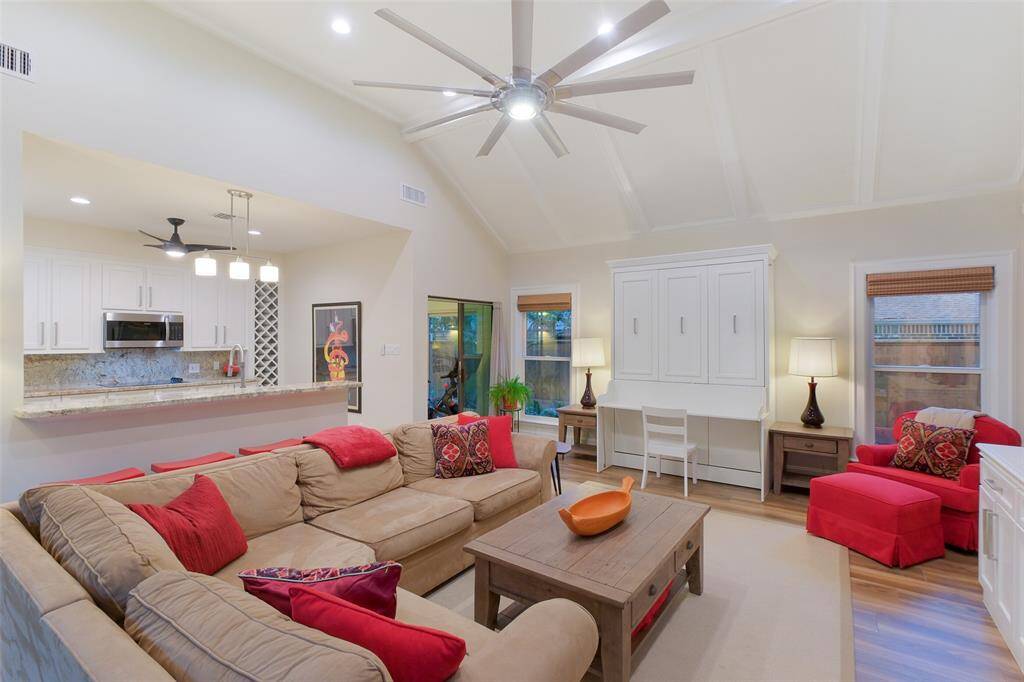 Guest House Living Room with Murphy Bed, ceiling fan, sunroom and covered patio.