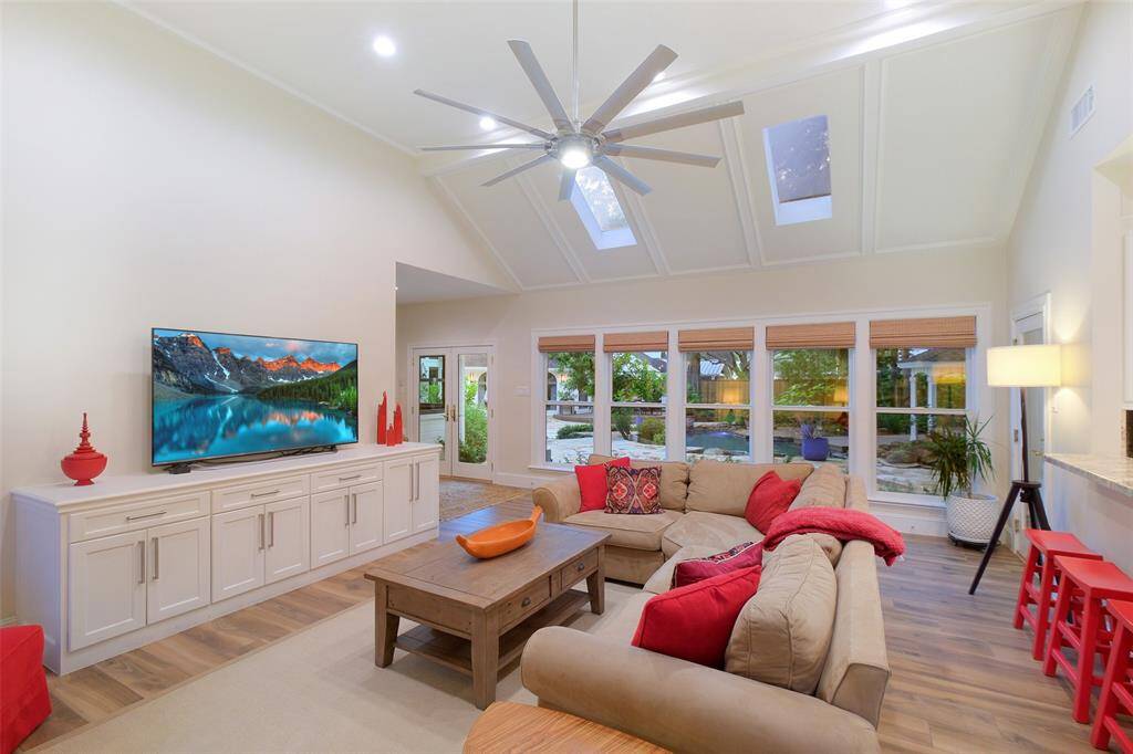 Guest House with tile floors, custom builtin cabinet, panoramic scenic windows with shades, also have custom shutters in storage if desired.