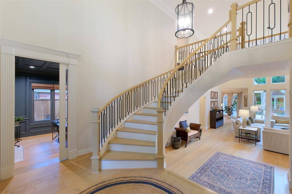 A Private Study with a deployable glass Pocket Door and Step-Down is noticed near the base of the stairs.