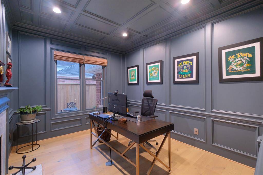 A Step-down spacious Office/Study with designer paint and custom wood work. Note the floor electrical plug!