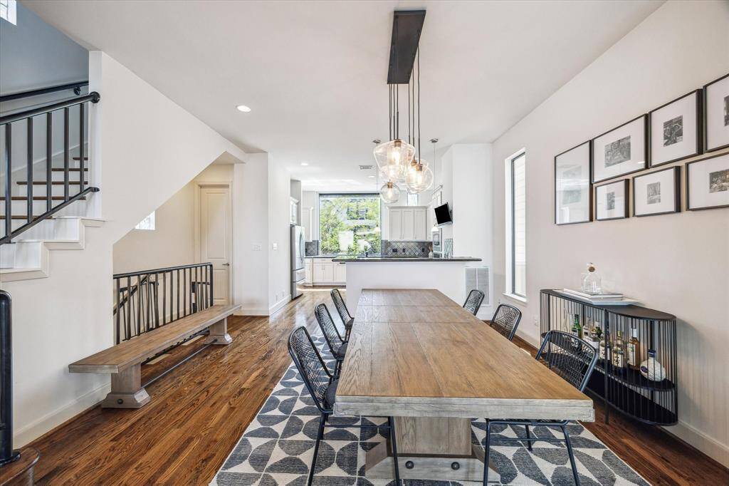 Another angle of the dining room showing the seamless flow into the kitchen.
