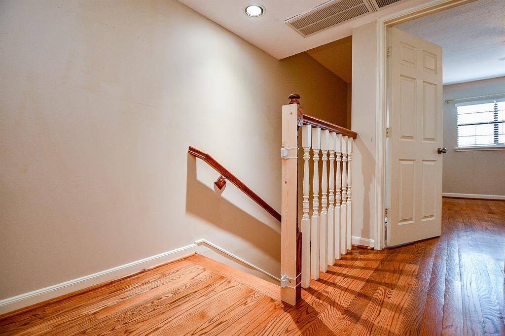 Discover two spacious bedrooms and a full bath on the upper level.