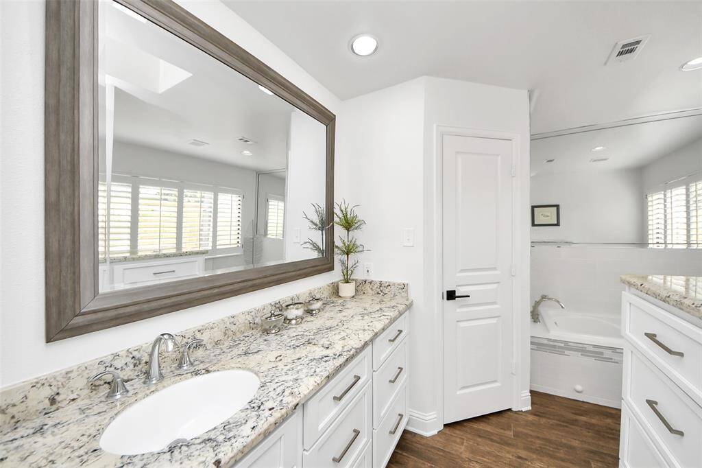 Hers Primary Bath (bath #1) - this is one of two primary baths. Pamper yourself in this private refuge with your conveniently connected walk-in closet.