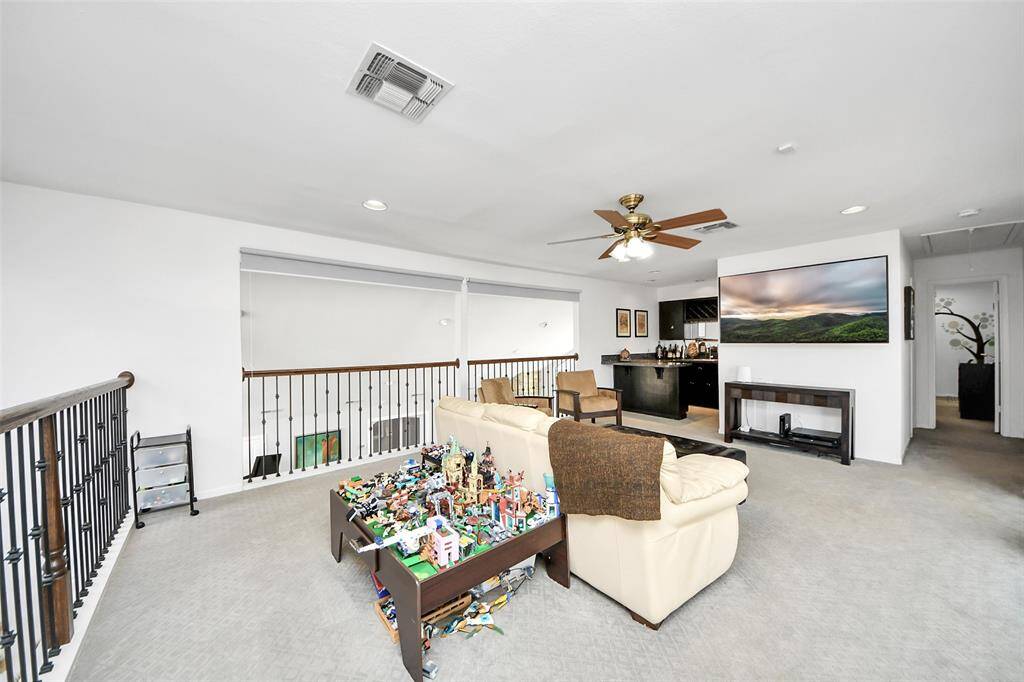 Huge upstairs flex room can serve as a gameroom, guest room, kids' playroom or a bonus space for relaxation or play!