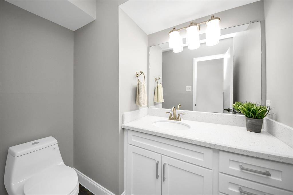 Upstairs half bath, adjacent to the flex room, is convenient for your guests.
