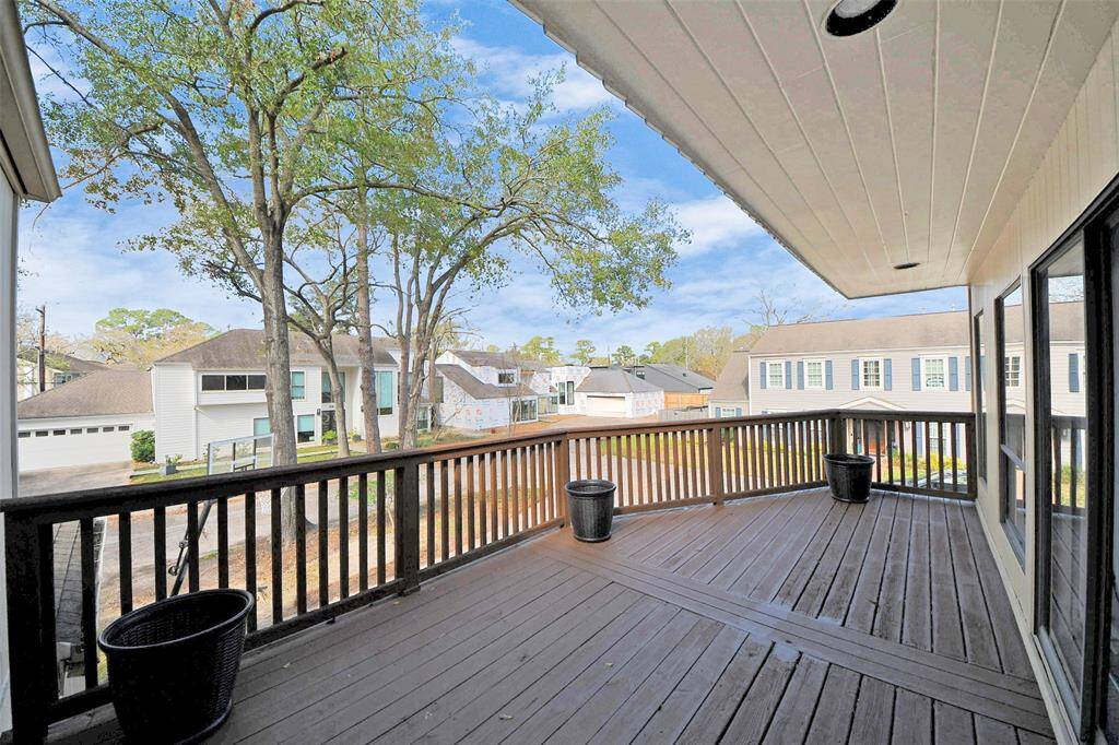 Seamlessly entertain indoors/outdoors with the large upstairs deck adjoining the Flex Room.