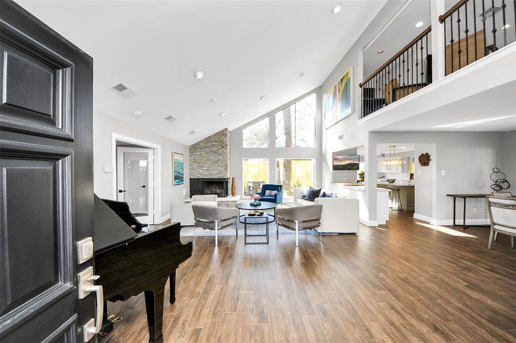 The wall of windows provide ample natural lighting with emphasis to the surrounding nature.