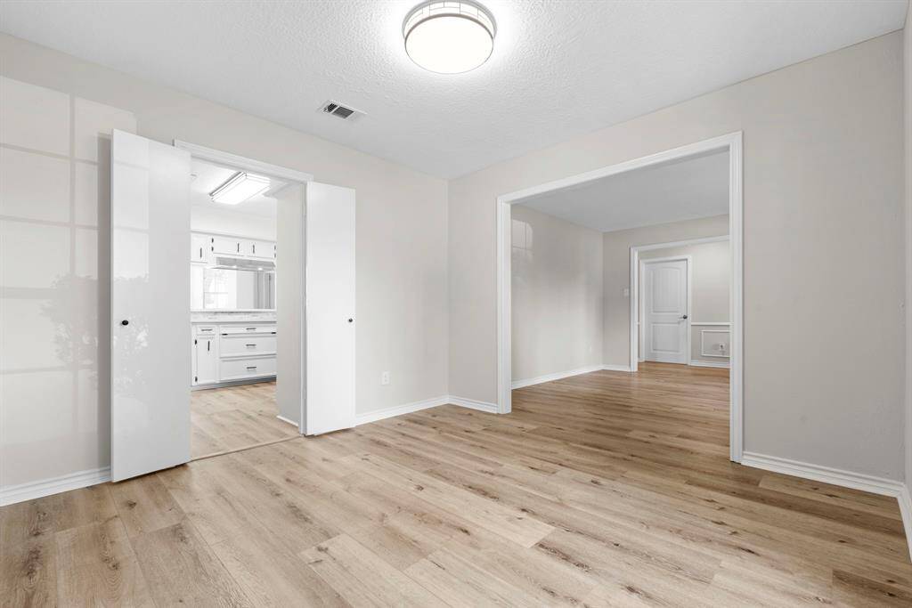 The formal dining room is just off of the formal living room and has double doors allowing easy access to the kitchen. Serving is a dream!