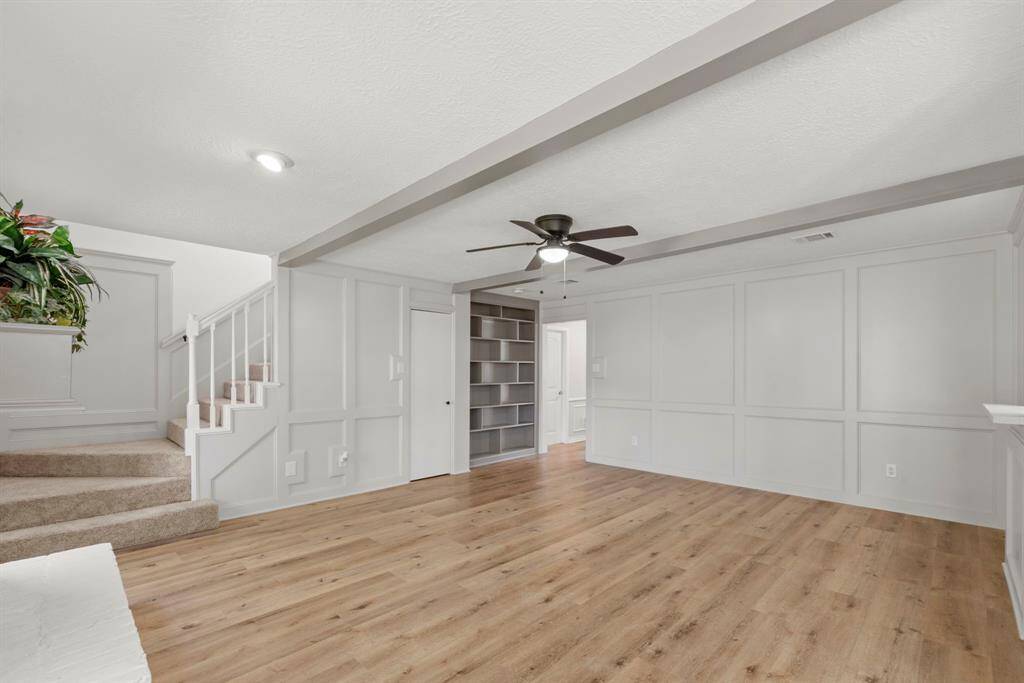 Built in storage in the family room, and that door leads to great under the stair storage!