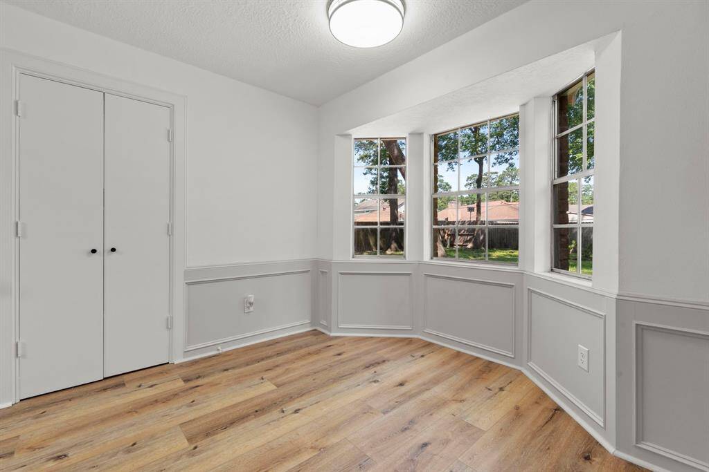 This is the breakfast room, just off of the family room. The double doors lead to the laundry room and half bath.