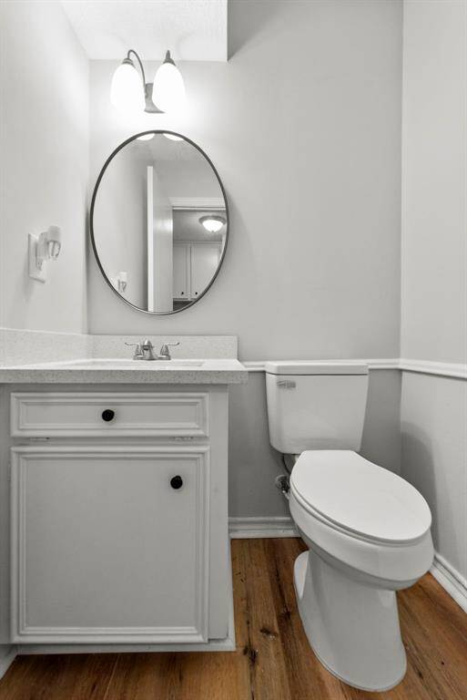 Just off of the laundry room is the fully updated half bath!