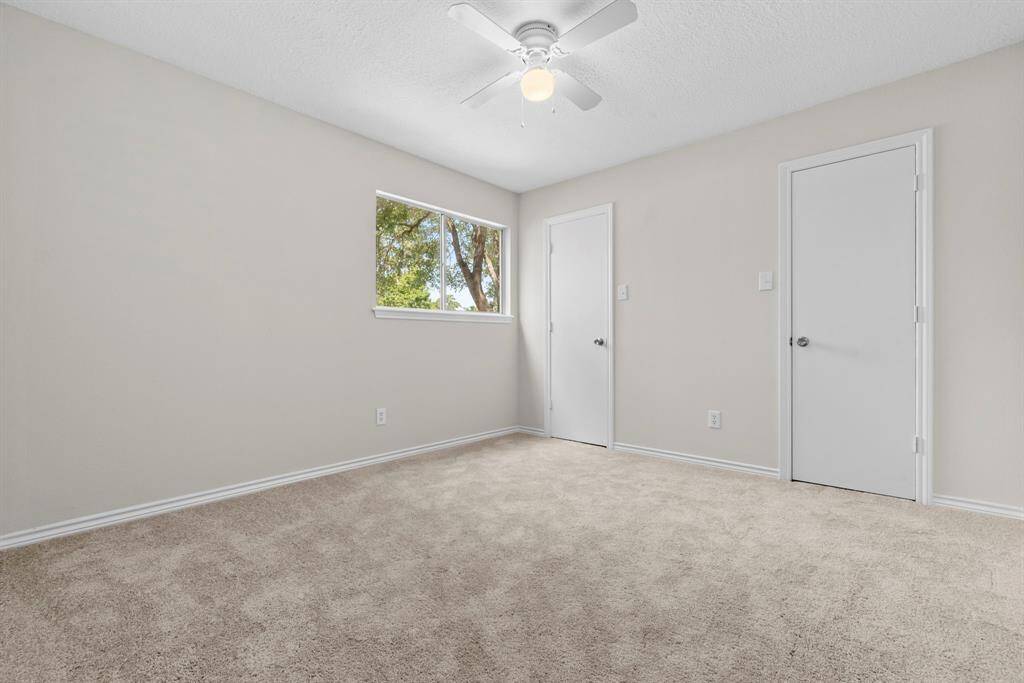 This is another secondary bedroom on the second floor. Fresh paint, recently replaced carpet, new ceiling fan, and two closets!