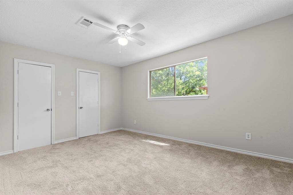 Third and final upstairs bedroom has recently replaced carpet, new ceiling fan, fresh neutral paint.