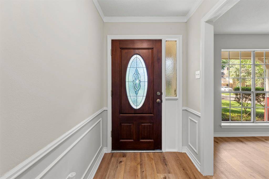 As you enter you will see the formal living and formal dining room to your left- to the right in this picture. Notice the fresh neutral paint and the gorgeous waterproof LVP floors!