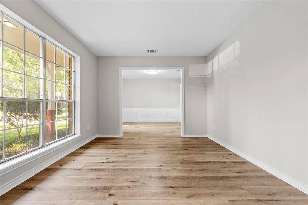 As you enter the home, to your left will be this large flex space that is the formal living room, but could be a play room, an office, or anything you can dream! It leads into the dining room.