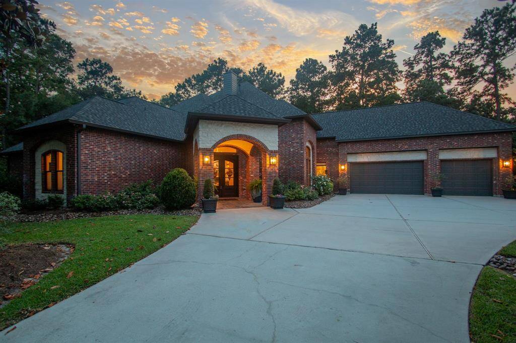 Welcome to 5314 Pine Wood Meadows Lane!  This home looks just magical and will create your own little getaway!  The modern pool was so well thought out and planned, down to ever last pad of decking, water feature and shape!  The downstairs patio and upstairs balcony offer additional living space to enjoy it all!