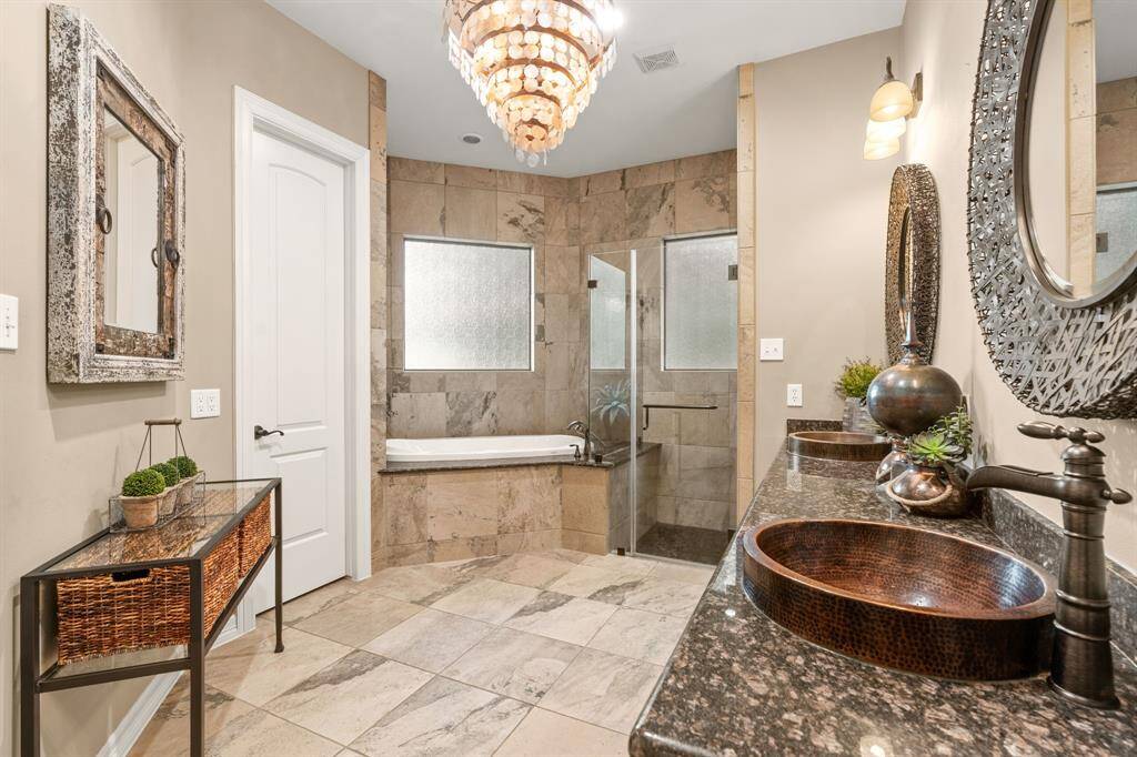 Ready for a quick shower or a soak in this air tub!  Yes, air circulates the water.  The double vanities and a nice size walk in closet included!