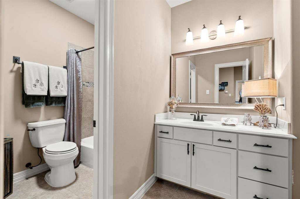 This bath is for the previous bedroom and also serves the game room and media room.