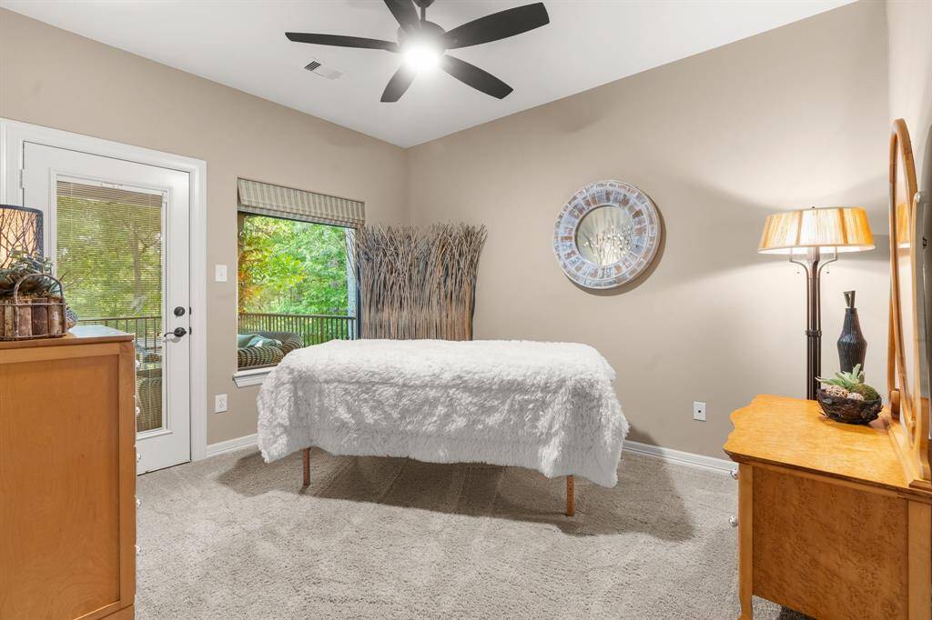 This is actually a bedroom currently serving as a spa room....it offers access to the balcony also.