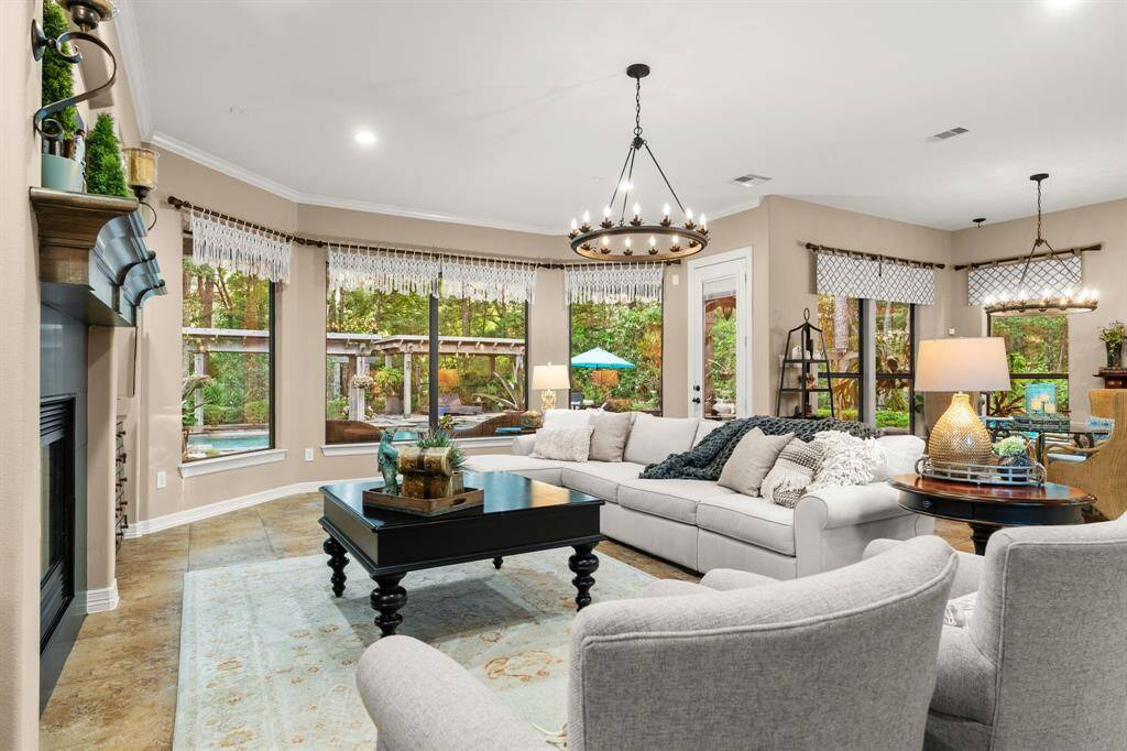 You will be mesmerized walking into this family room with the views to the backyard gardens and pool!