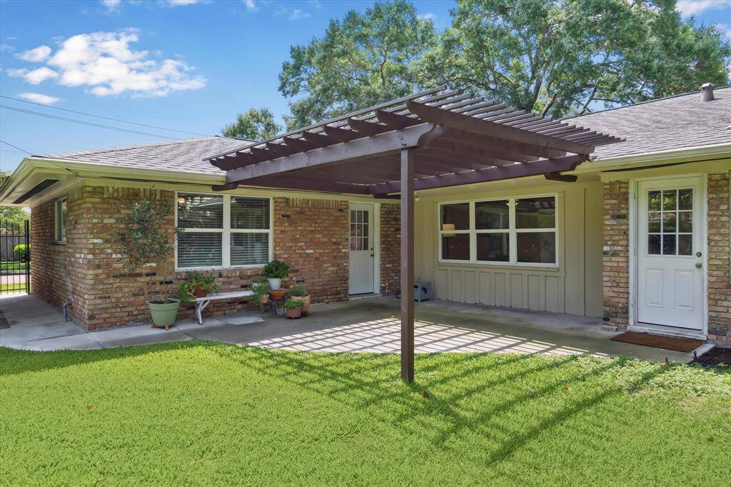 The patio, with doors to the bedroom wing and breakfast room/den.